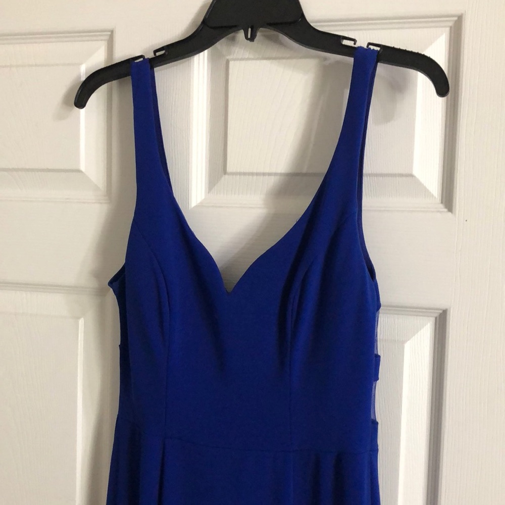 Beautiful blue dress with some see through material in the back.